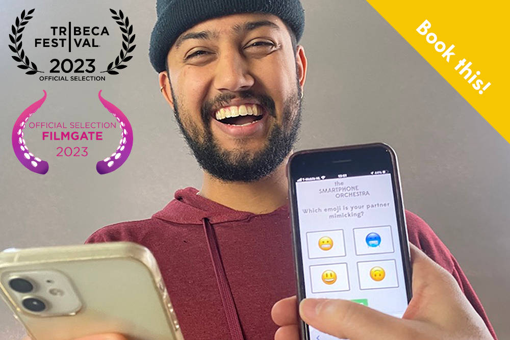A young man in a red sweater laughing during a game within Emojiii, with two phones in view, and a yellow banner in the top right corner reading "Book this!"